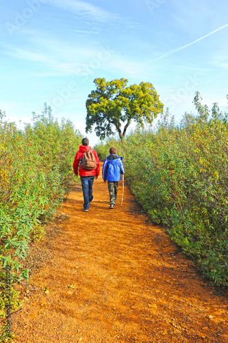 Children hiking in Via Verde of the Natural Park Sierra Norte of Seville, Andalusia, Spain