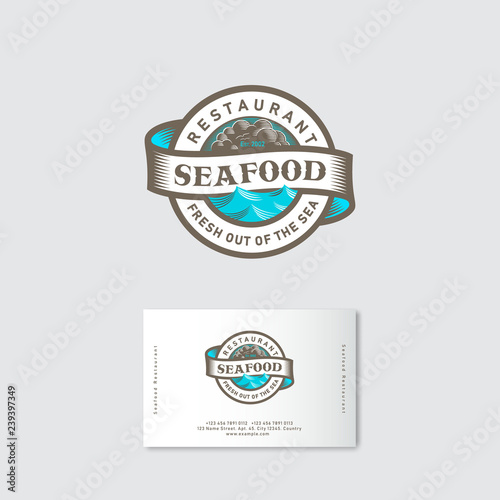 Seafood restaurant logo. Blue sea with waves  ribbon and lettering in a circle. Engraved style. Business card.