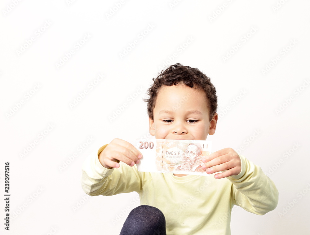 little boy with bank notes and smiling little boy with bank notes and smiling