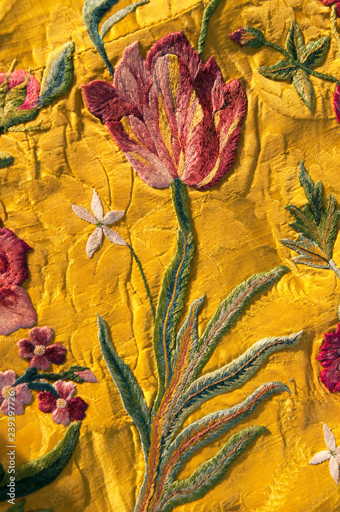 Ταπετσαρία I have owned this a piece of gold coloured silk fabric embroidered with  flowers for 30 years