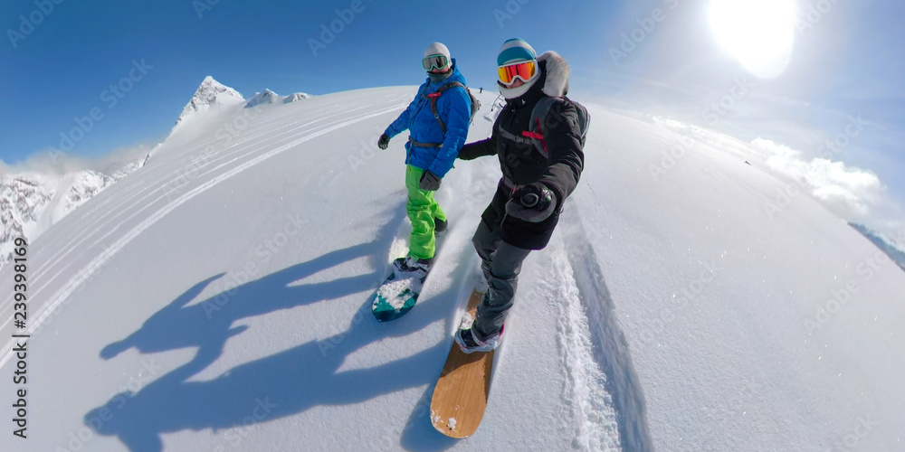 Ταπετσαρία VR 360: Active young couple snowboarding together off piste on a sunny day
