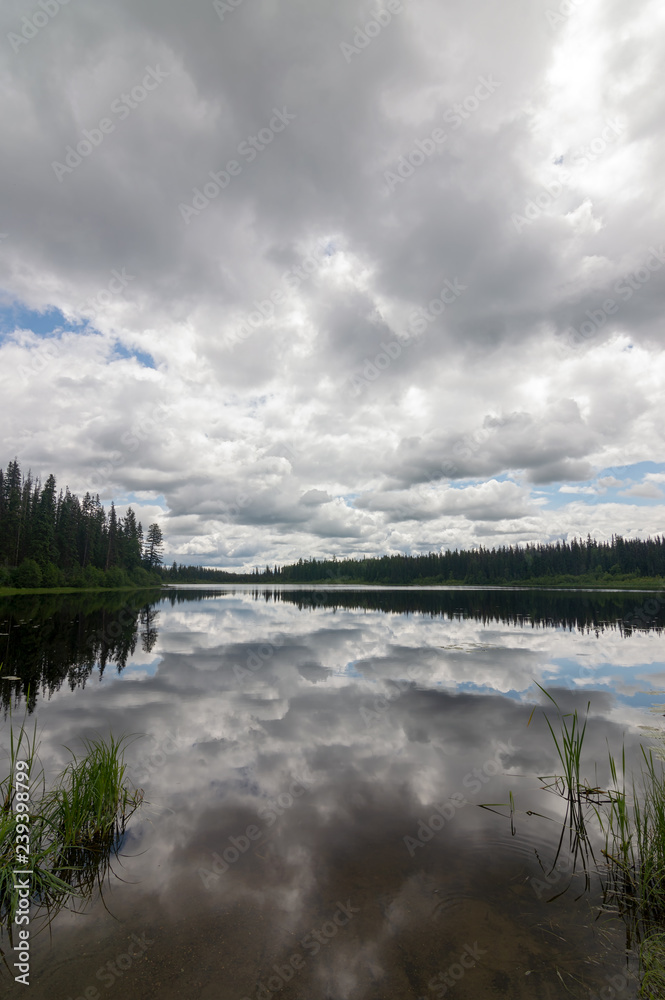 Clouds above the lake at Mackenzie Lake Recreation Site in British Columbia, Canada
