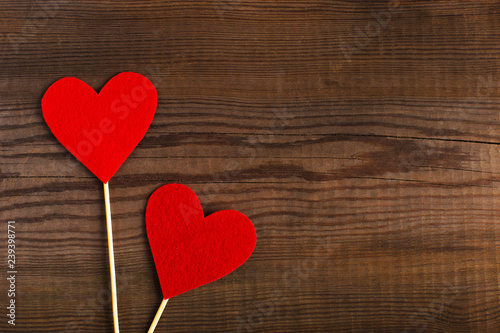 Red hearts on a wooden table. Blank or greeting card background for Valentine s Day. Place for text  copy space.