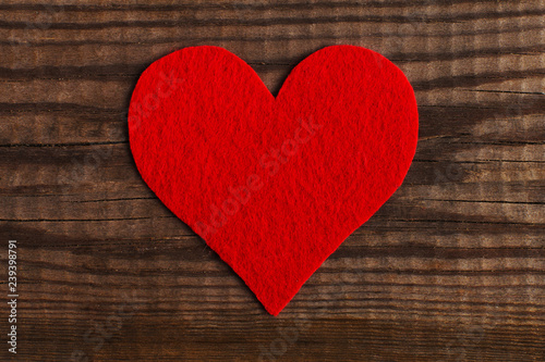 Red hearts on a wooden table. Blank or greeting card background for Valentine's Day. Place for text, copy space.