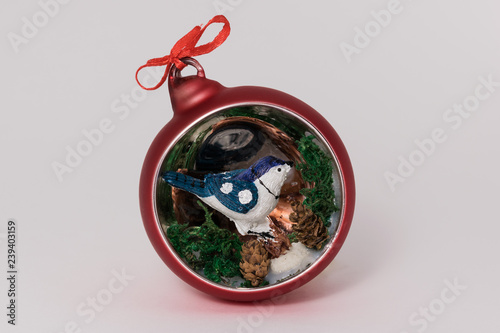 Bird in red chistmas ball