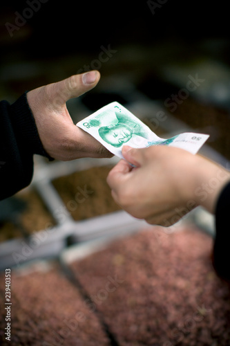 Money being handed over.