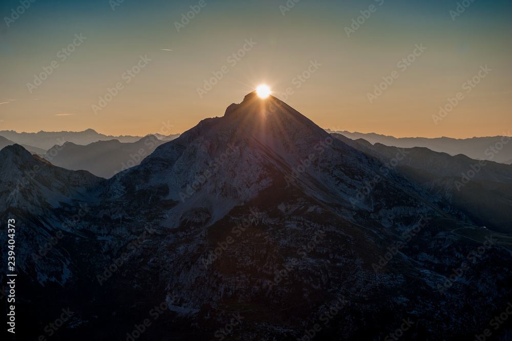 Sun rising behind the mountains