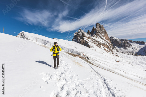 Man hiking on top of snowy mountain