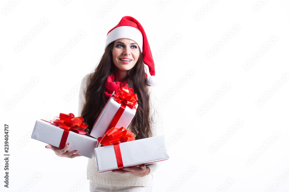 Festive brunette holding pile of gifts on white background. Festive brunette holding pile of gifts on white background.