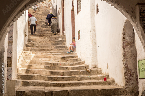 Moroccan women walking in the narrow street, Morocco