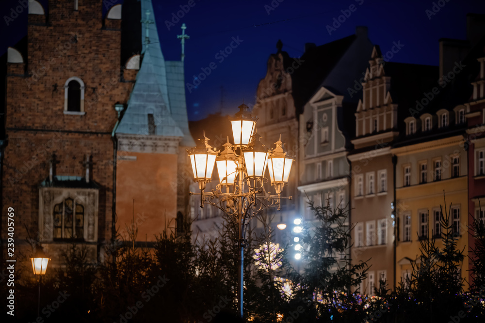 View at city pole lamp in Christmas fair decoration in Wroclaw, Poland