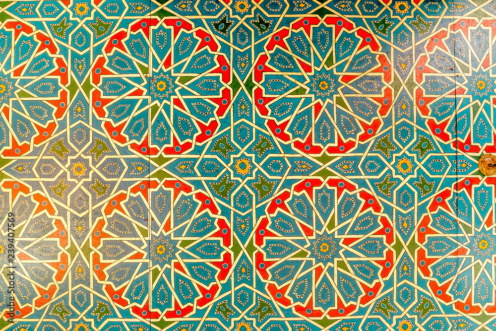 Colorful geometric pattern of Islamic mosaic decorated walls in Morocco