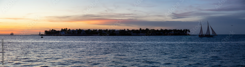 Panoramic view of Sunset Key Island during a vibrant colorful sunset. Taken in Mallory Square, Key West, Florida Keys, United States.