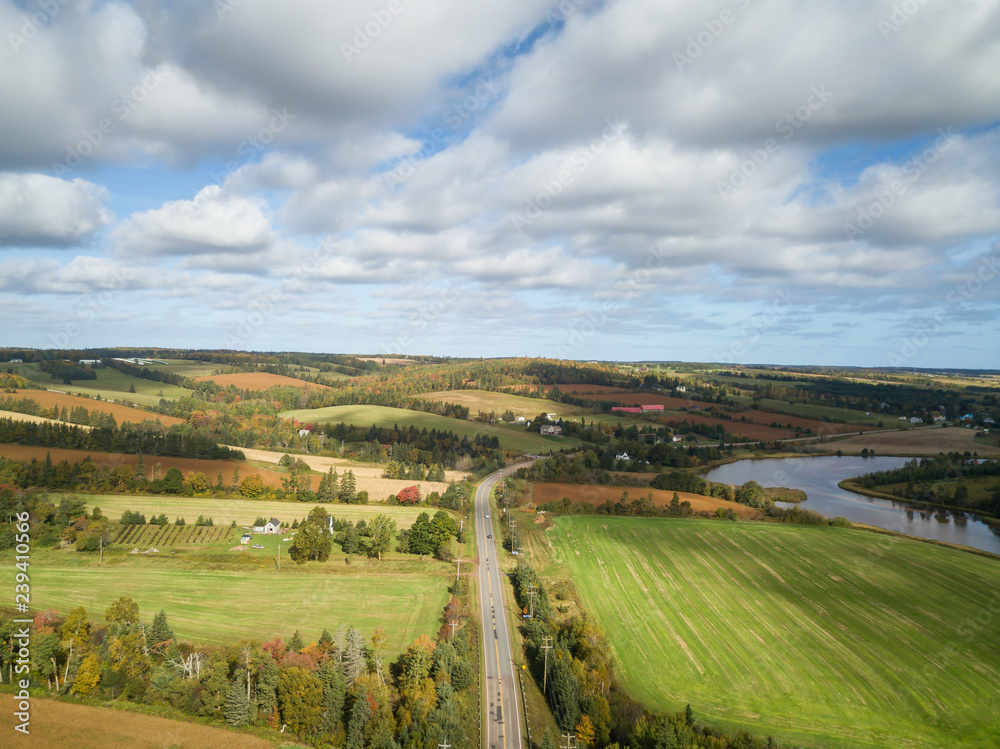 Aerial panoramic landscape view of Farm Fields during a sunny day. Taken near New Glasgow, Prince Edward Island, Canada.
