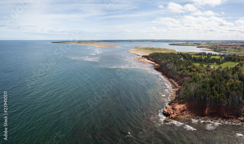 Aerial panoramic view of a beautiful rocky shore on the Atlantic Ocean. Taken in Cabot Beach Provincial Park, Prince Edward Island, Canada.