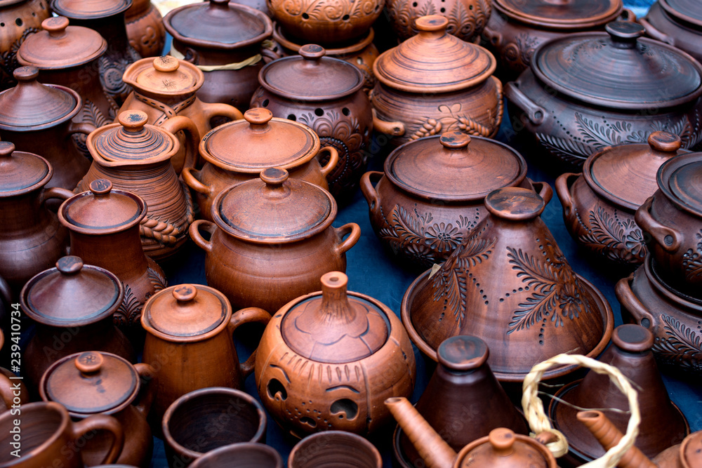 Clay pots, ware, handmade, made for sale. National crafts. Small business. Pottery. A ware for food. Environmentally friendly ware. Business on production of a pottery. Folk art Clay pots, ware, handmade, made for sale. National crafts. Small business. Pottery. A ware for food. Environmentally friendly ware. Business on production of a pottery. Folk art