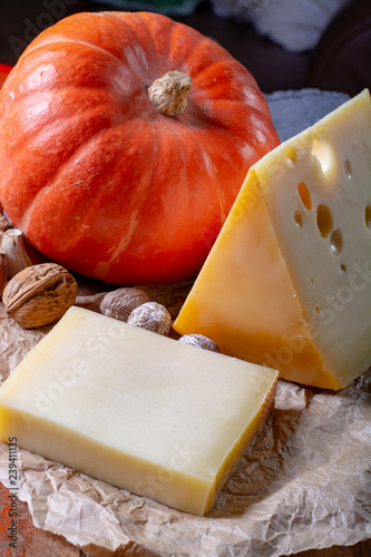 Ingrediens for traditional seasonal Swiss dish, pumpkin fondue with gruyer and emmentaler cheeses, fresh creme and nutmeg