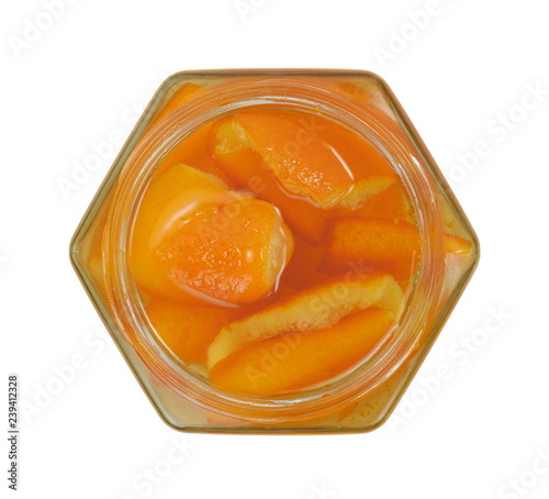 Orange peel preserve in a transparent jar isolated on white background. Glyko- koutaliou- portokali. photo