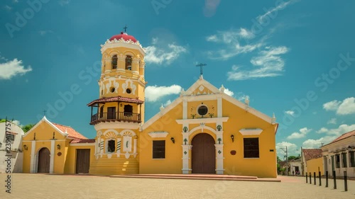 Timelapse of Santa Barbara colonial church in Mompox, Bolivar, Colombia, on a calm sunny day. photo