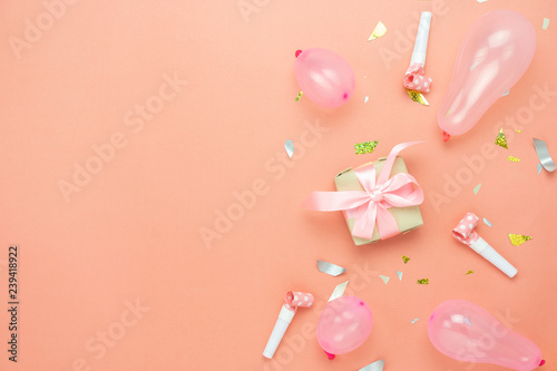 Table top view of Merry Christmas decorations & Happy new year 2019 ornaments concept.Flat lay essential difference objects gift box & balloon with golden confetti on modern pink paper background.