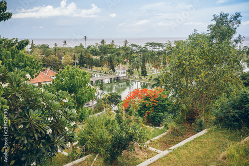 Panoramic view of the Royal water palace in Taman Ujung park which is situated near the ocean, Bali, Indonesia