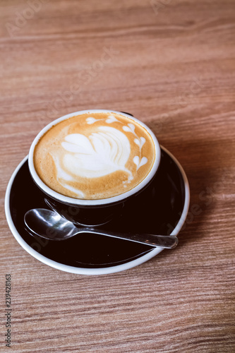 Hot Latte Coffee on wooden floor