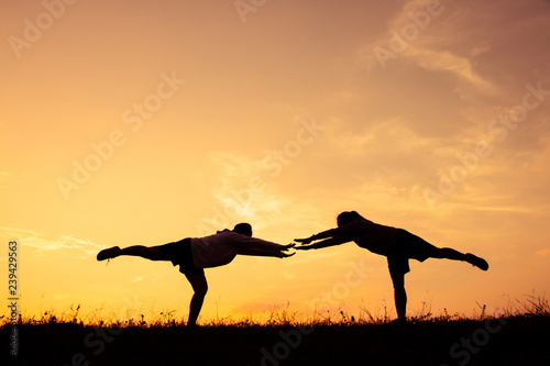 Fototapeta Naklejka Na Ścianę i Meble -  Silhouette girl yoga for health, Concept run for health.