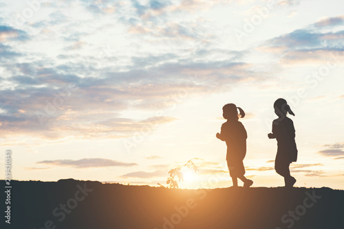 Silhouette of children playing