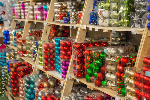 Wallpaper Mural Sale of Christmas toys in the supermarket. Balls of different colors for the Christmas tree on the supermarket shelves.  Torontodigital.ca