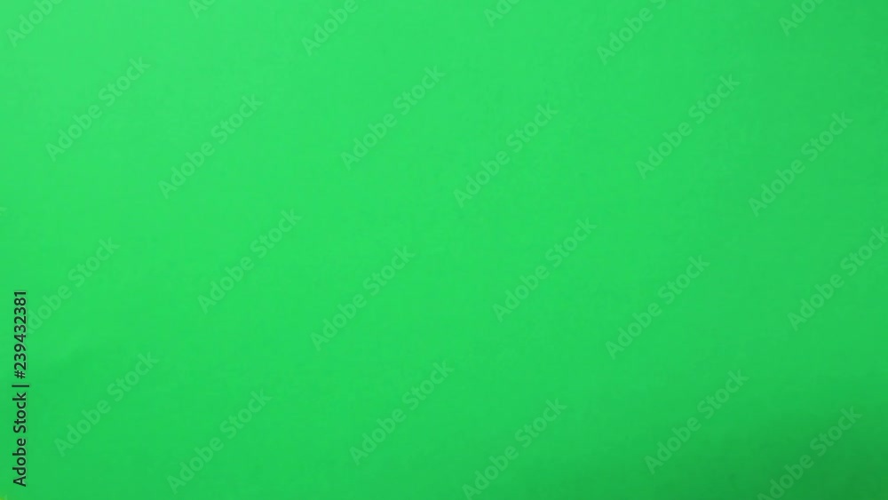 Male hand on a green background raises and lowers fingers up. Male hand on a green background raises and lowers fingers up.