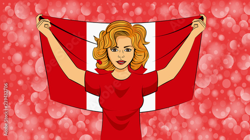 Blonde girl holding a national flag of Canada photo