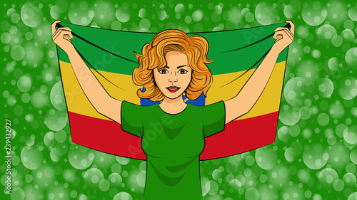 Blonde girl holding a national flag of Ethiopia