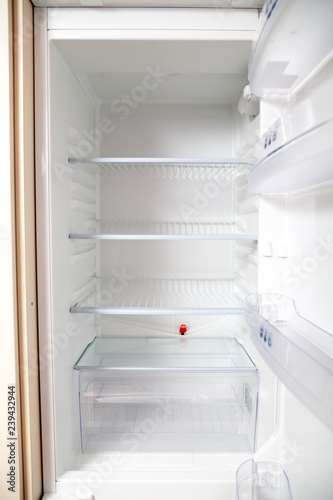 empty open refrigerator close-up