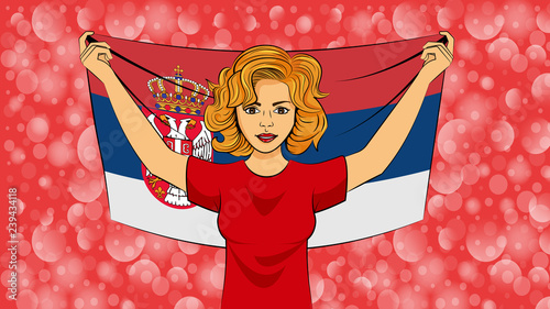 Blonde girl holding a national flag of Serbia photo