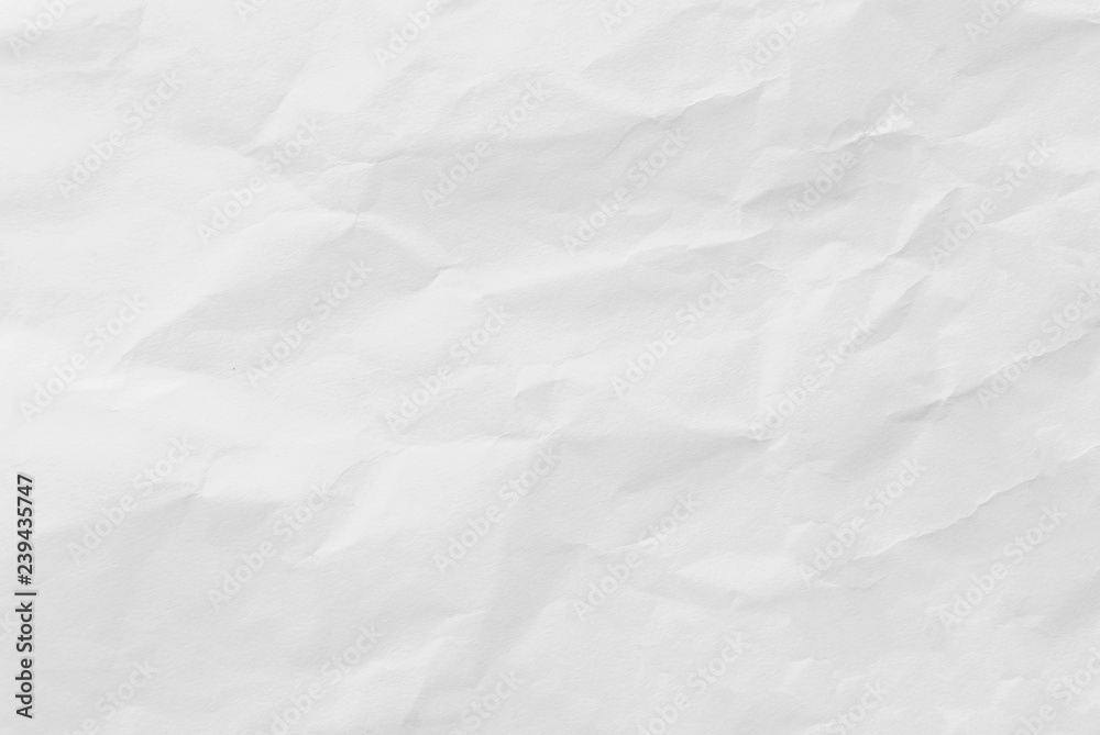 Fototapeta premium White crumpled paper texture background. Close-up.