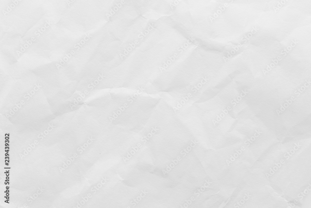 Fototapeta premium White crumpled paper texture background. Close-up.