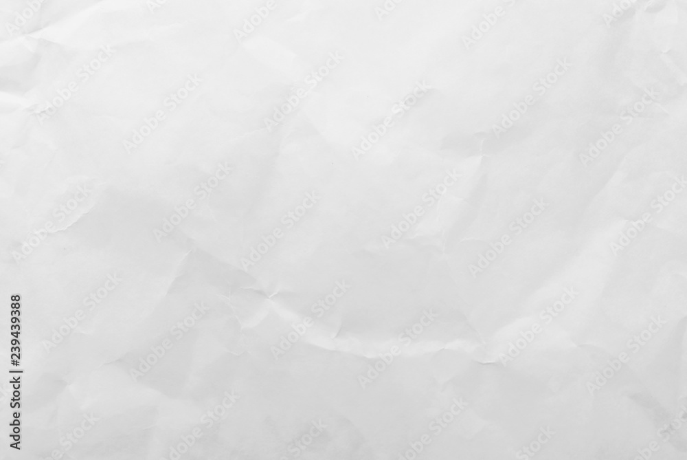 White crumpled paper texture background. Close-up. White crumpled paper texture background. Close-up.