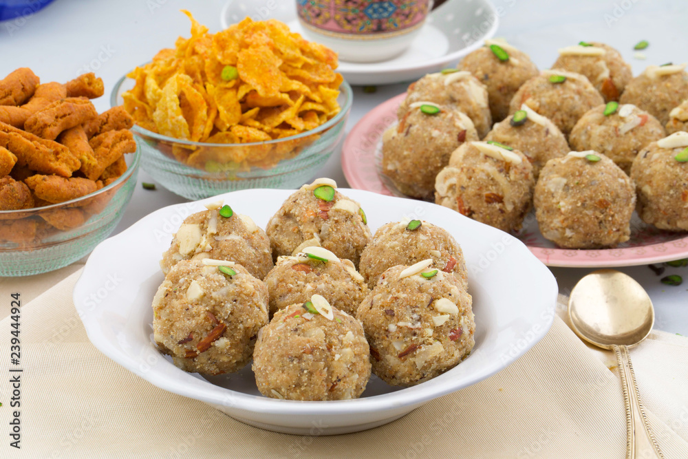 Indian Traditional Sweet Food Urad Dal Laddu Also Know as Laddoo, Ladoo, Laddo are Ball-Shaped Sweets Made of Butter, Dry Fruits, Fenugreek and other Spices. Urad Dal laddu Sweet Mostly Eat in Winter Indian Traditional Sweet Food Urad Dal Laddu Also Know as Laddoo, Ladoo, Laddo are Ball-Shaped Sweets Made of Butter, Dry Fruits, Fenugreek and other Spices. Urad Dal laddu Sweet Mostly Eat in Winter