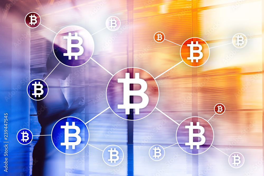 Bitcoin cryptocurrency and blockchain technology concept on blurred skyscrapers background. Bitcoin cryptocurrency and blockchain technology concept on blurred skyscrapers background.