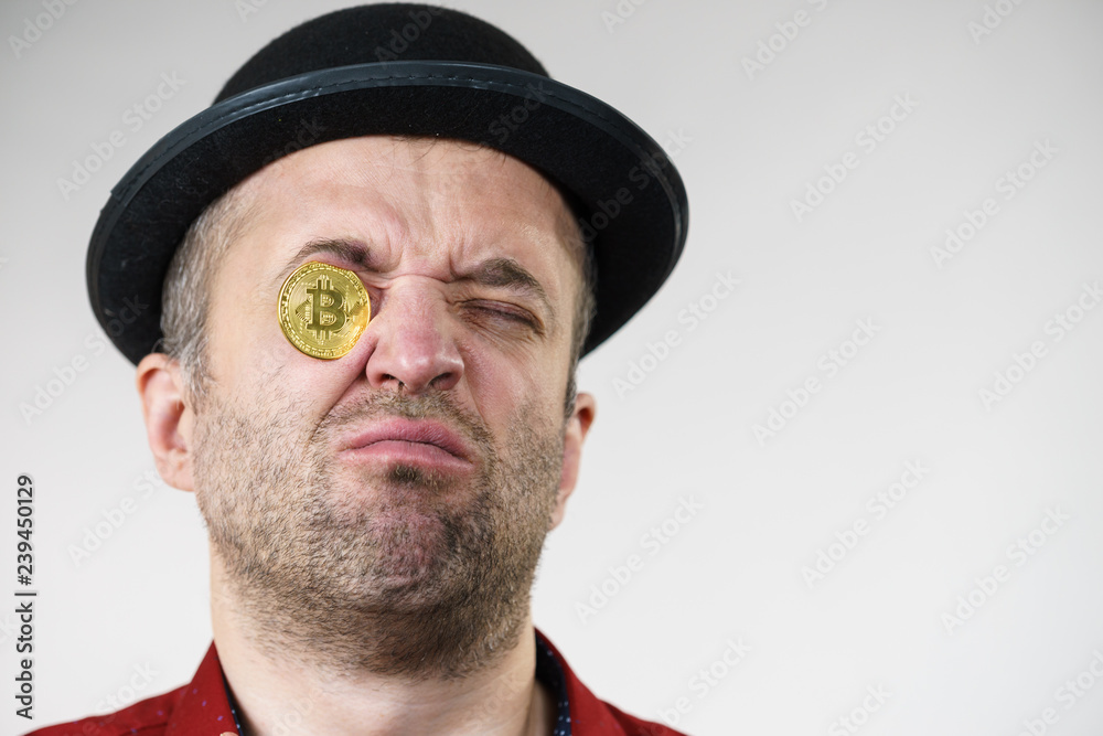 Man having bitcoin in eye Man having bitcoin in eye