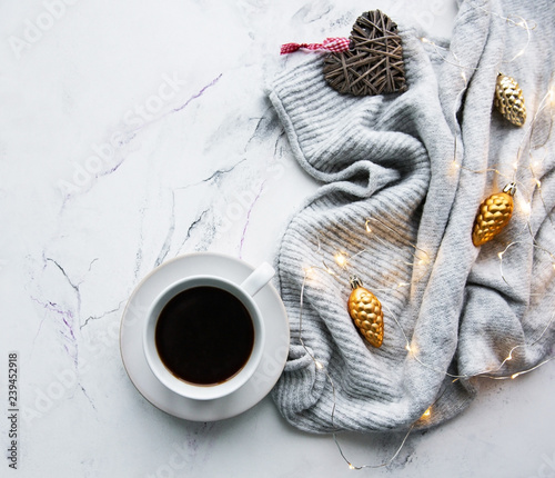 Cup of coffee, scarf and garland