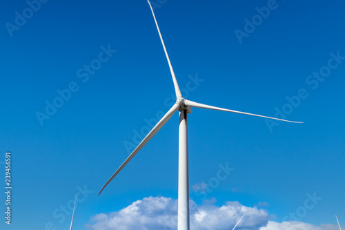 Isolated Wind Turbine against Blue Sky