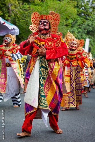 Dancer men in traditional Balinese costumes and masks Tari Wayang Topeng - characters of Bali culture. Temple ritual dance at ceremony on religious holiday. Ethnic festivals, arts of Indonesian people