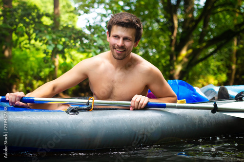 Smiling man in kayak