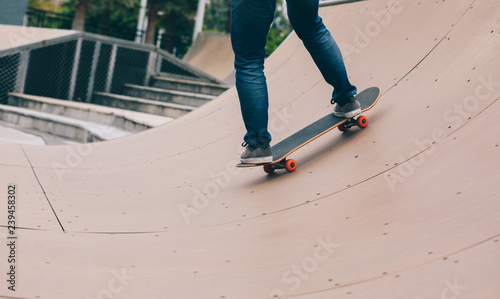 skater  skating on ramp at skatepark photo