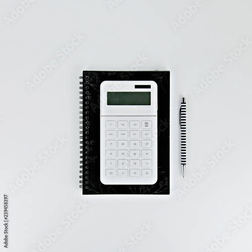 notebook and pen on white background