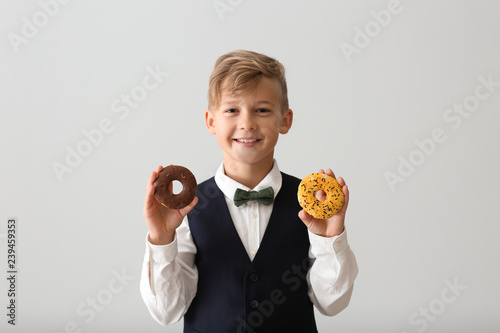Cute little boy with donuts...