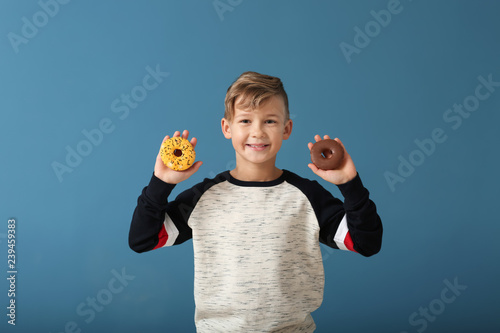 Cute little boy with donuts...