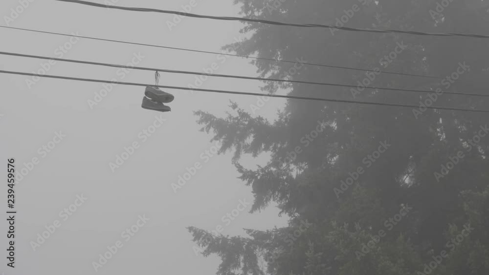 shoes hanging from the power line.