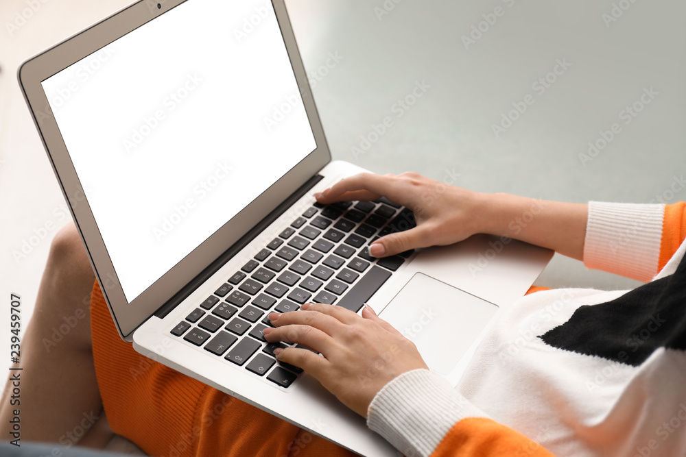 Woman using laptop at home Woman using laptop at home